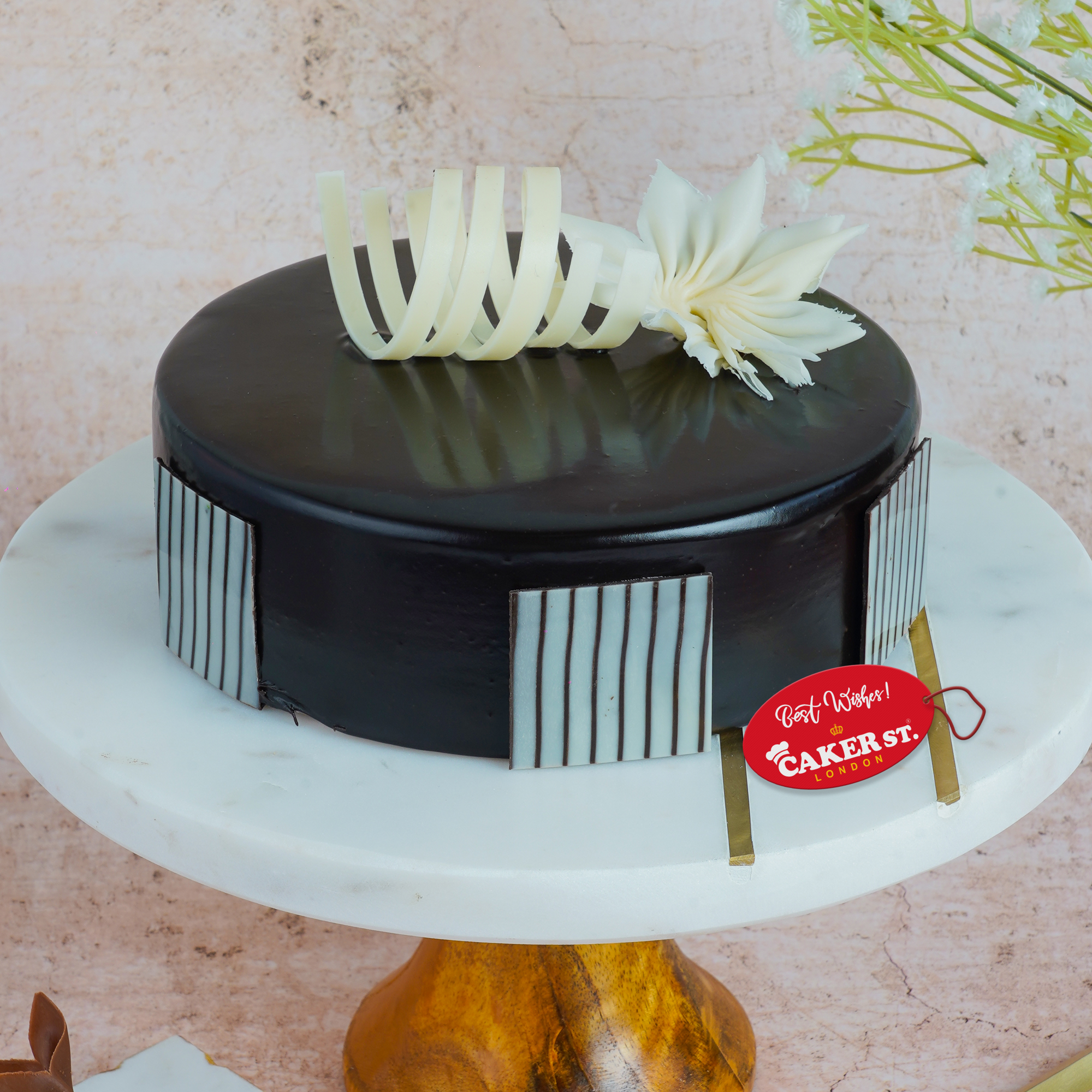 Elegant Birthday Cake with Floral & Stripe Detail